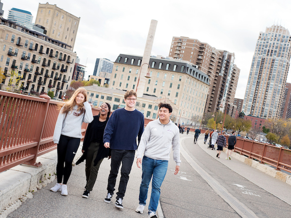 Students on the stone arch bridge